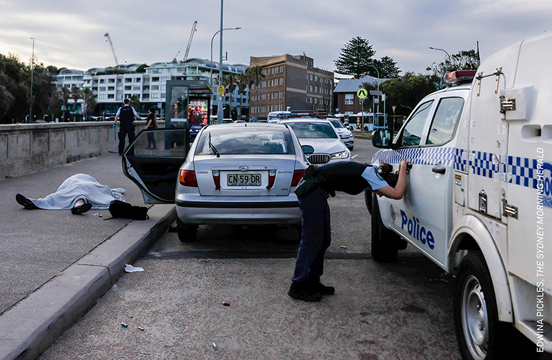 Bondi Beach Terror Attack by Edwina Pickles. Credit: © Edwina Pickles, The Sydney Morning Herald. Title: Bondi Beach Terror Attack Credit: © Edwina Pickles, The Sydney Morning HeraldCaption: An overwhelmed police officer leans over near the bodies of Boris (69) and Sofia (61) Gurman. During the Bondi Beach Terror Attack, the couple were killed while attempting to disarm one of the shooters. Sydney, Australia, 14 December 2025.Story: During Bondi Beach’s 'Chanukah by the Sea,' a community event celebrating the Jewish holiday, two armed men motivated by ISIS ideology attacked participants, killing 15 people. The first victims were Boris (69) and Sofia (61) Gurman, a Ukrainian-Jewish couple who had migrated to Australia decades earlier. Dashcam footage revealed that Boris approached one of the attackers and successfully wrested a rifle away. Shortly after, Syrian-Australian shopkeeper Ahmed al-Ahmed charged the second gunman and disarmed him. In their struggles against the gunmen, al-Ahmed was shot twice and wounded, and the Gurmans were killed. According to authorities, these collective acts of defiance delayed the shooters and saved lives.Prime Minister Anthony Albanese called the mass shooting an antisemitic attack and the deadliest terrorist incident on Australian soil ever. The shooting has prompted a significant re-evaluation of public security and religious freedom protections in Australia.