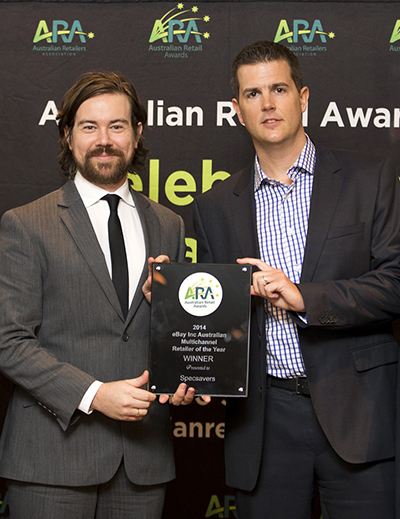 Specsavers' Paul Bott and Jack Siloray collect the ARA eBay Multichannel Retail Award for 2014.