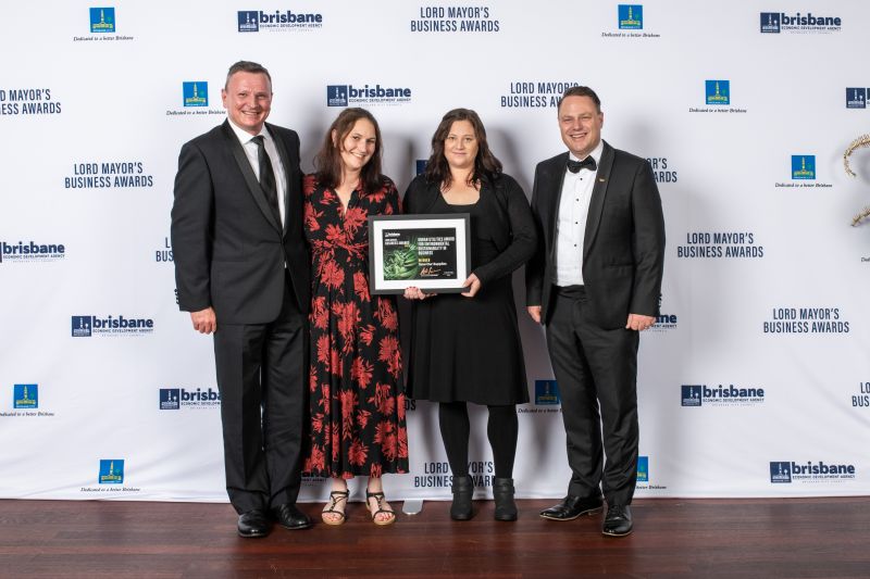 Save Our Supplies founder Claire Lane (centre left) and team member receive the 2022 Urban Utilities Award for Sustainability from sponsor CEO Paul Arnold (left) and Brisbane Lord Mayor Adrian Schrinner. Image: Brisbane Economic Development Agency.