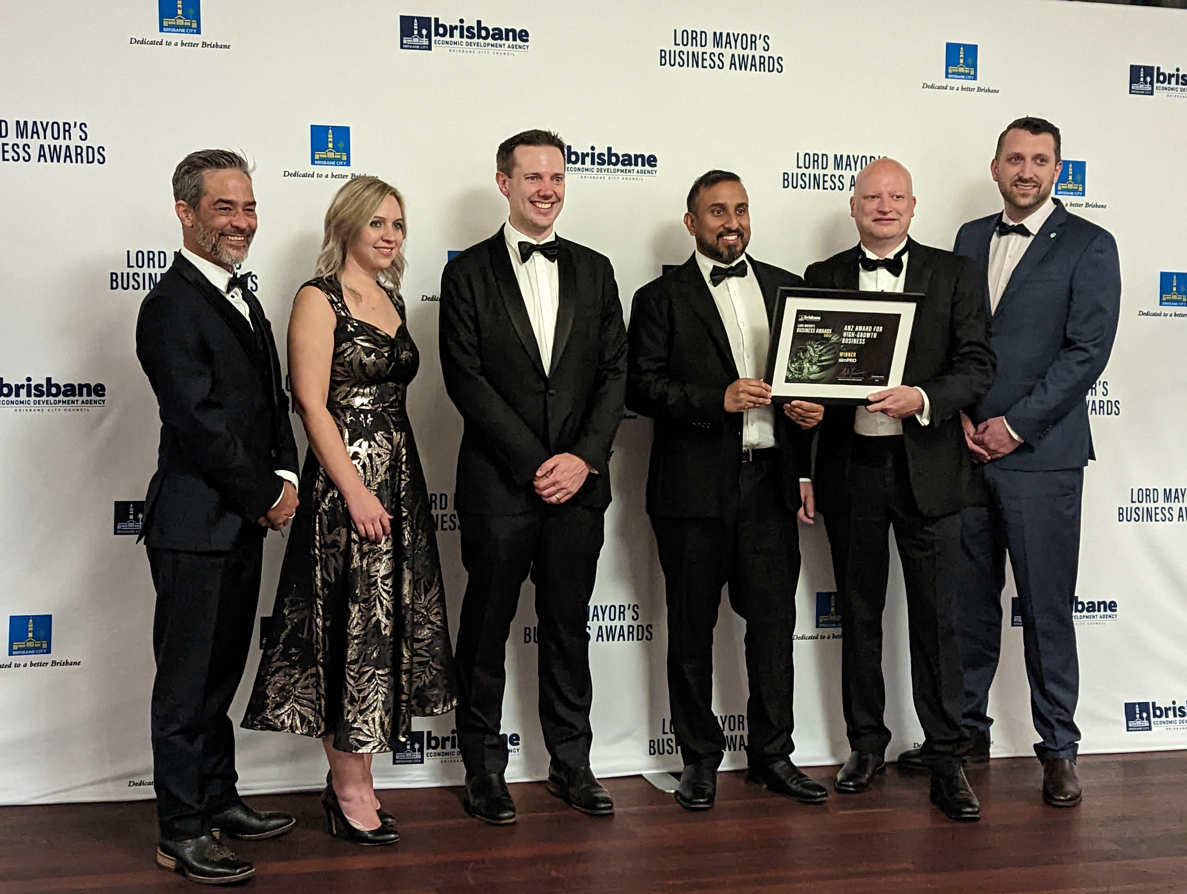 The dual award winning simPro team celebrate at the 2022 Lord Mayor's Business Awards. They won the ANZ Award for High-Growth Business and the prestigious Optus Platinum Award for Brisbane Business of the Year. Image: Brisbane Economic Development Agency.