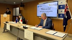 City of Moreton Bay Mayor Peter Flannery right and Mayor Takashi Namba of Shizuoka City sign the memorandum