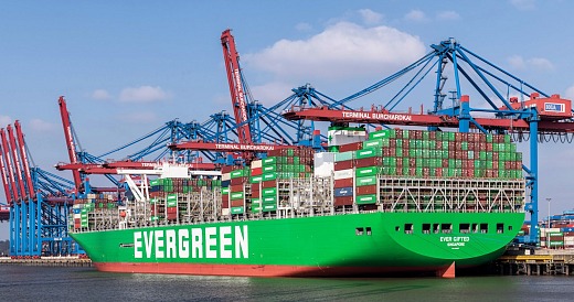 Evergreen container ship at port. Image from Peacock Tariff Consulting.